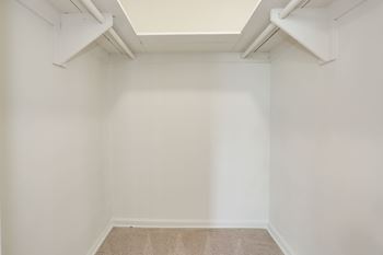 A room with a carpeted floor and white walls